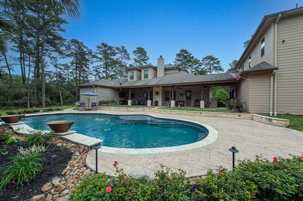 Another view the pool and back patio. The landscaping around the pool features upgraded landscaping lighting.