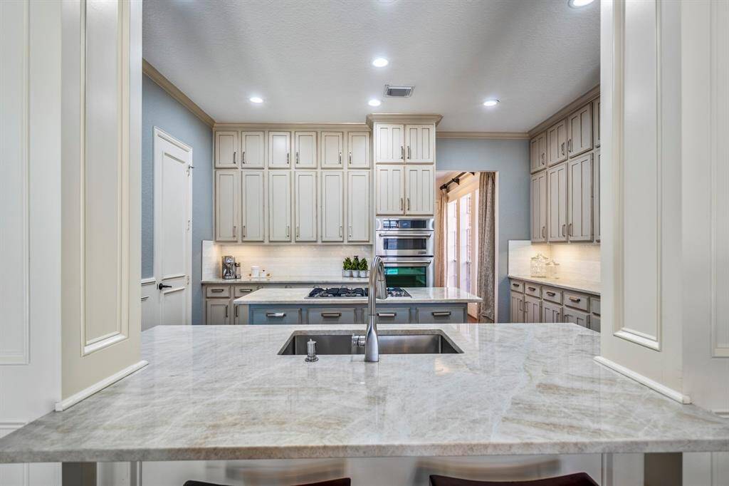 A chef's paradise with a sleek eat-in bar.