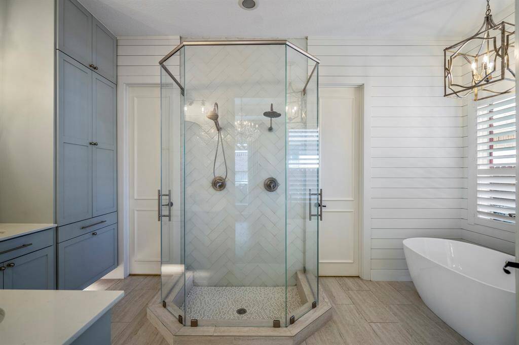 Indulge in luxury with this stunning bathroom featuring dual shower heads.