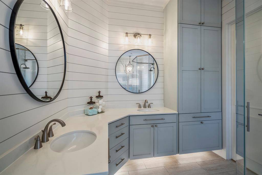 Elegant dual sinks with chic under-cabinet lighting.