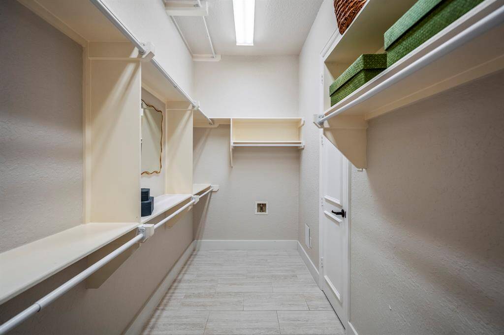 Spacious closet conveniently located in the primary bathroom.