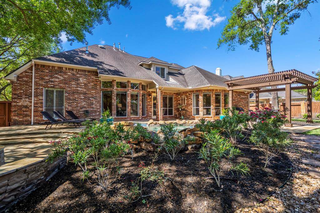 Lush, vibrant landscaping creates a serene outdoor oasis.