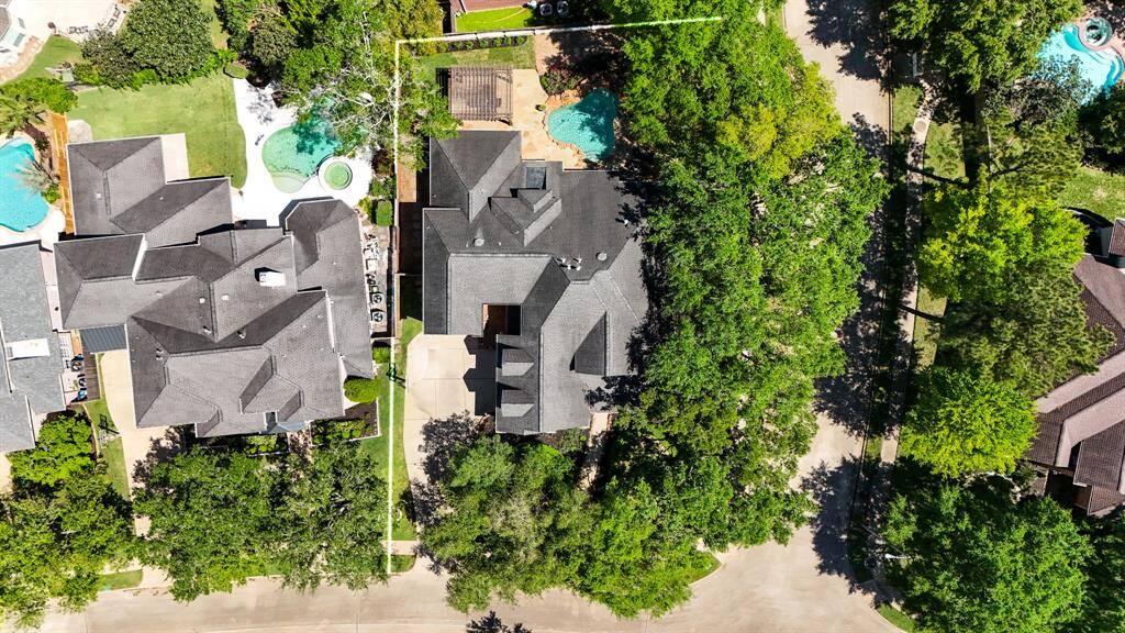 Aerial view showcasing the home's spacious layout and lush surroundings.