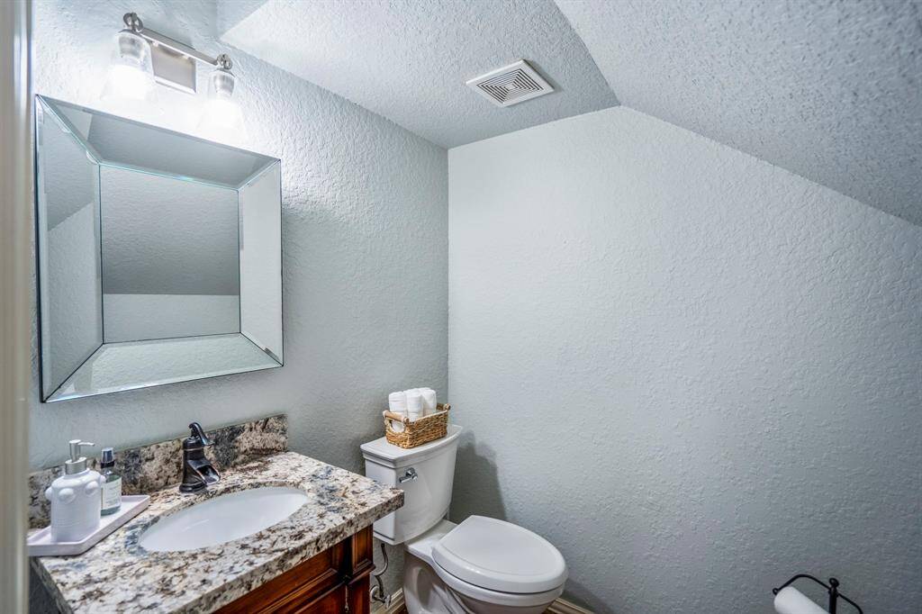 Elegant guest powder room with stylish finishes.
