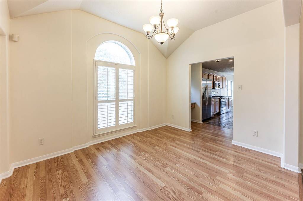 The spacius and bright formal dining room.