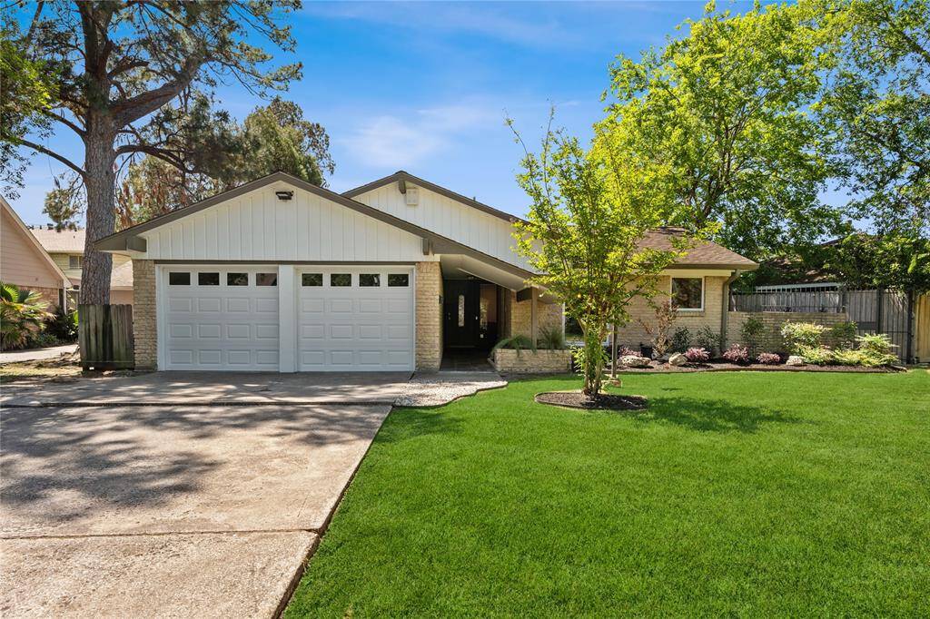 Discover this beautifully updated mid-century modern gem, featuring a spacious single-story layout and a convenient double garage.
