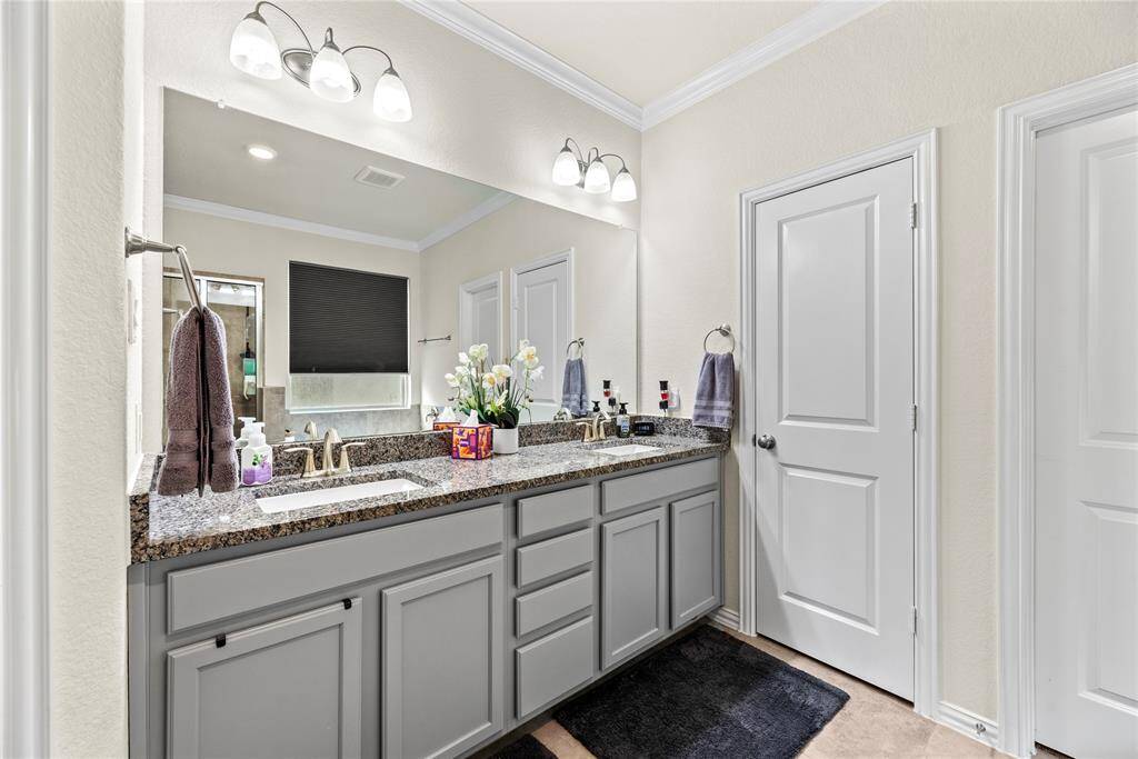 The primary bath has granite counters, two walk-in closets and lots of storage.