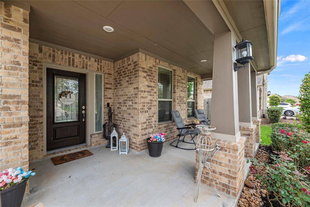 This home features a welcoming front porch as well as a covered patio out back.