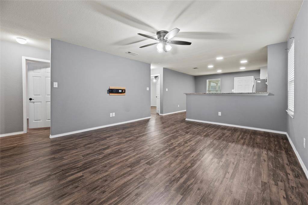 Family room looking into the kitchen. LVP flooring throughout.