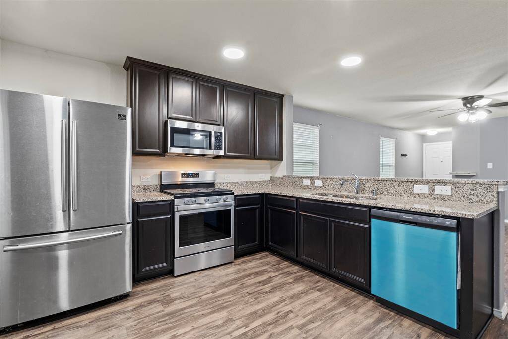 Beautiful kitchen with granite countertops, stainless steel appliances, new dishwasher and large breakfast bar.