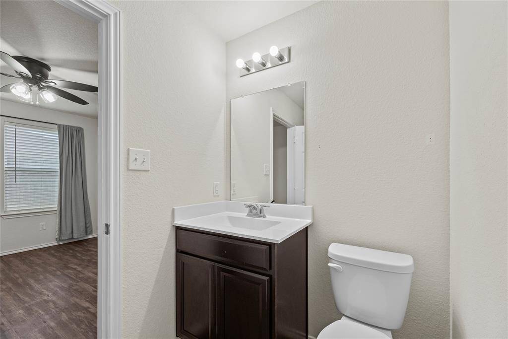 Primary bathroom has a single vanity.