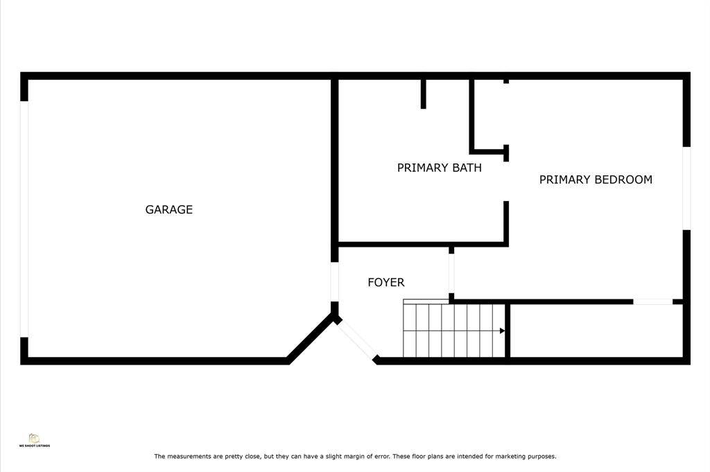This floor plan features a spacious garage, a foyer at the entrance, a primary bedroom with an adjoining primary bath, and a stairway for access to other levels.