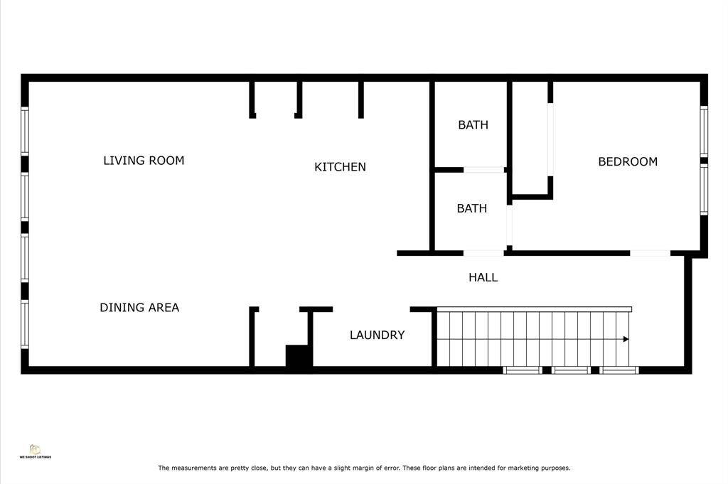 This floor plan features an open living room and kitchen layout with an adjacent dining area. It includes one bedroom and one bathroom. The laundry area is conveniently located near the hall, which also provides access to the stairs.