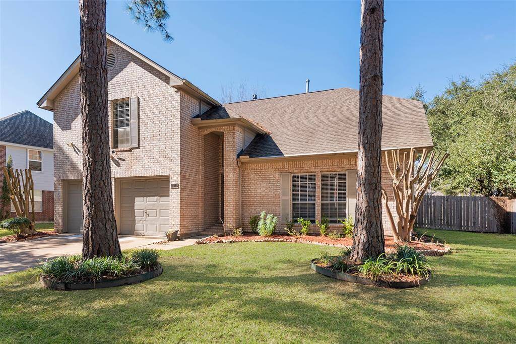 Take a look at this manicured front yard with mature shade trees & 2 story covered front entry.