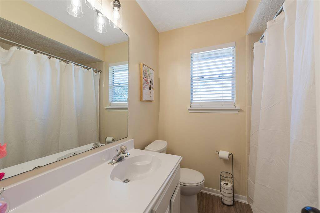 Secondary bathroom - well maintained & lovely engineered wood flooring.