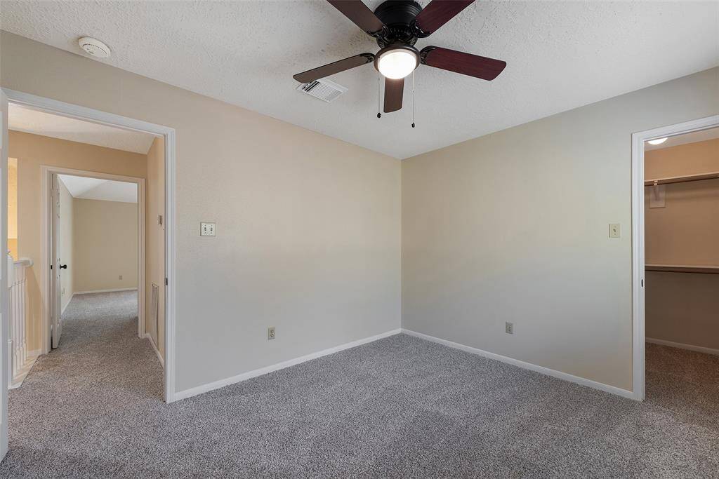 Secondary bedroom with nicely sized walk-in closet.