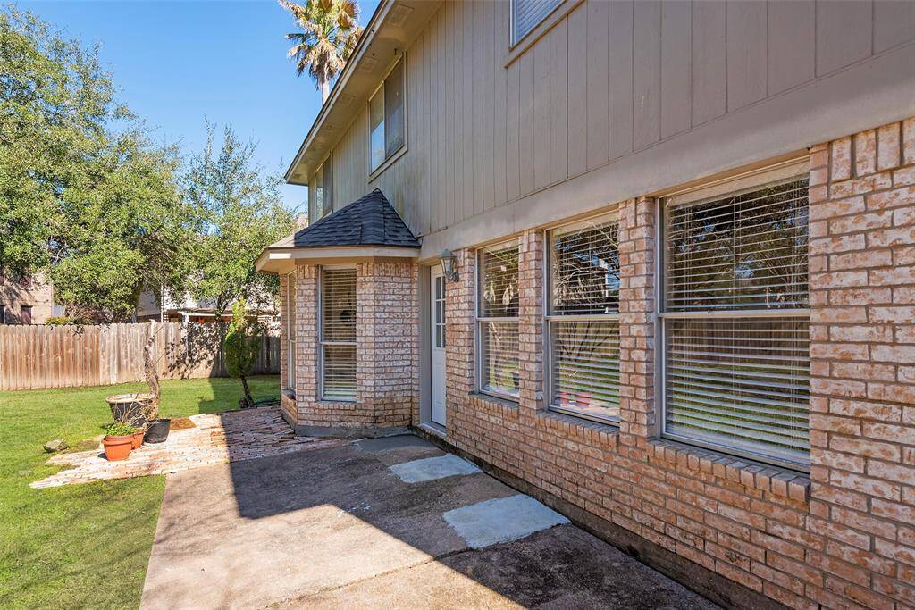 The back door opens to the spacious patio area!