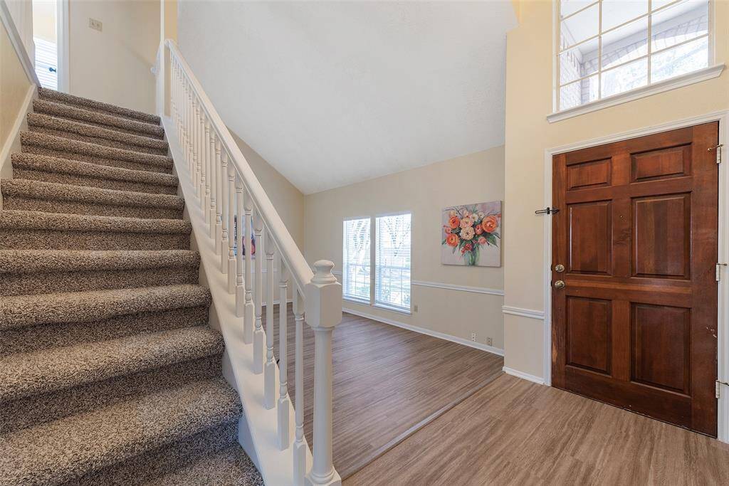 The front door opens to attractive Vinyl plank flooring & an abundance of natural light!
