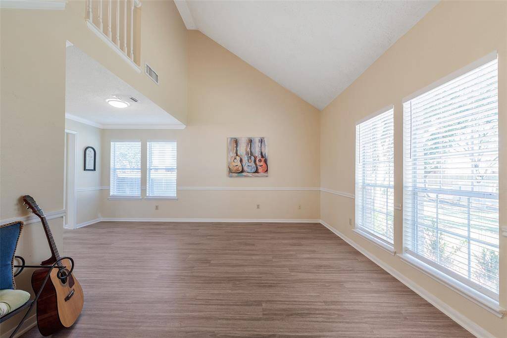 Another look at the 2 large windows for this area. Combined formal living & dining - use the space for whatever layout needs you desire! Create a library/office area, elegant formal dining space - or more!