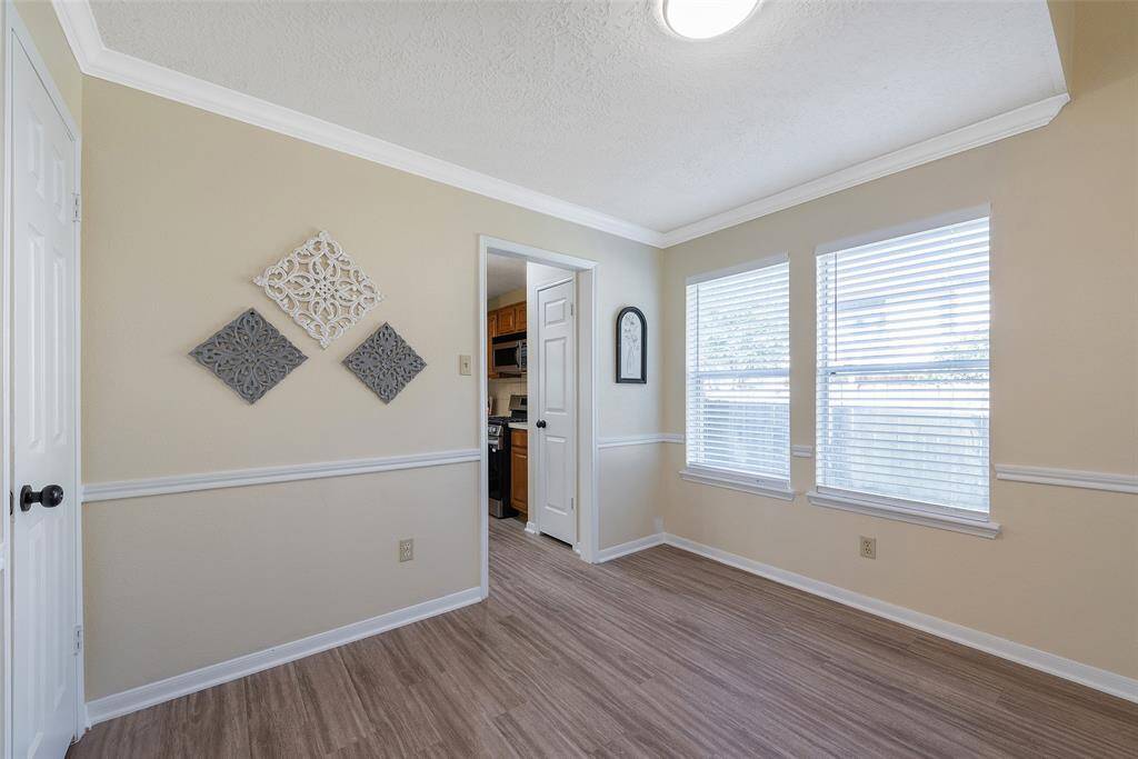2 windows with blinds also give this space great natural lighting when desired. Note the decorative crown molding to compliment the chair-rail molding.
