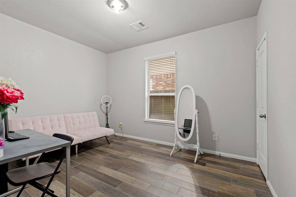 This flex room can become an additional bedroom, or a home office so you can get some work done. It features engineered wood floors, and windows with privacy blinds.