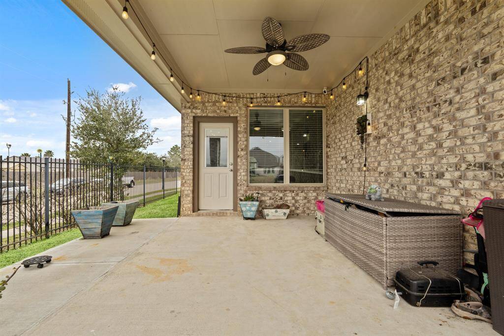 Enjoy entertaining under this fantastic covered patio with a ceiling fan to keep you cooler during the warmer months.
