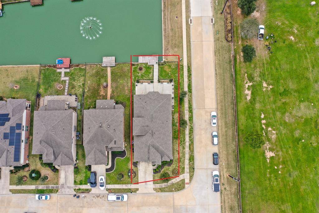 This aerial view showcases the INCREDIBLE 7,663 sqft corner lot.
