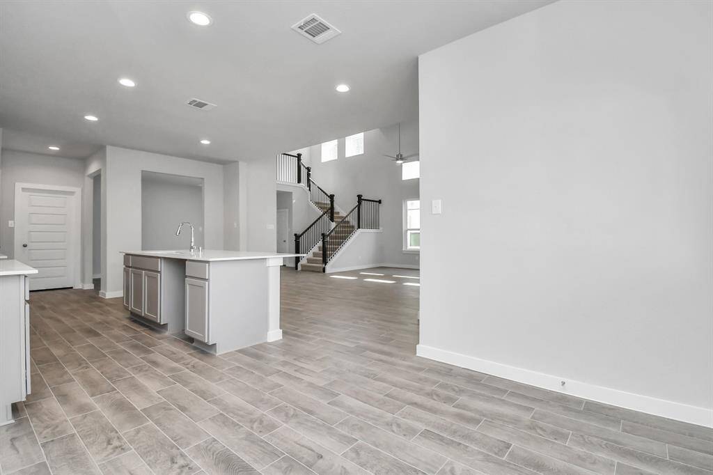 Enjoy breakfast with ease in the connected and cozy breakfast nook, seamlessly integrated with the kitchen for utmost convenience. Sample photo of completed home with similar floor plan. Actual colors and selections may vary.