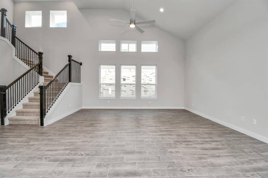 Another view of the heart of the home. Sample photo of completed home with similar floor plan. Actual colors and selections may vary.