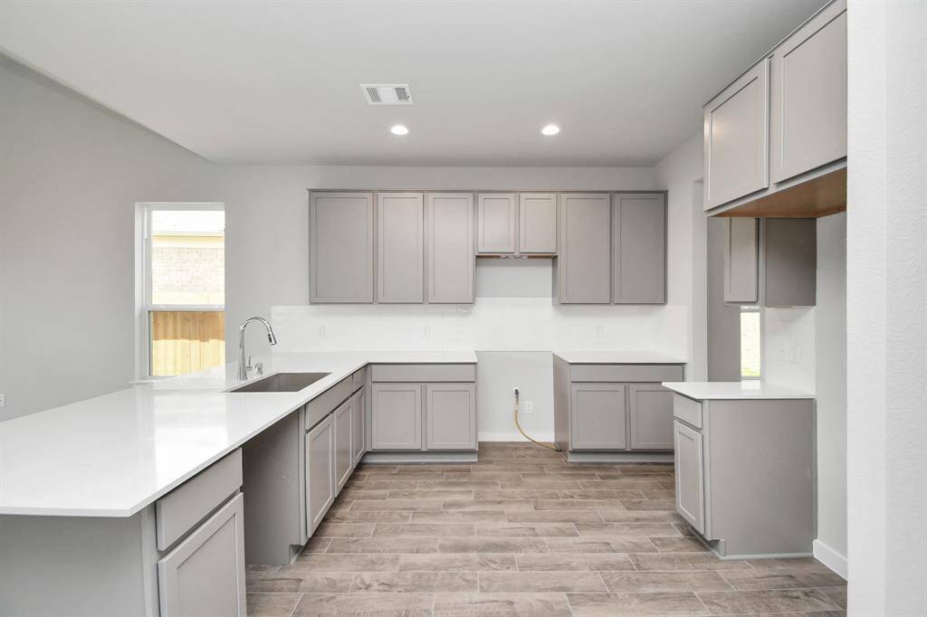 This generously spacious kitchen is a dream realized! Sample photo of completed home with same plan. Actual colors and selections may vary.