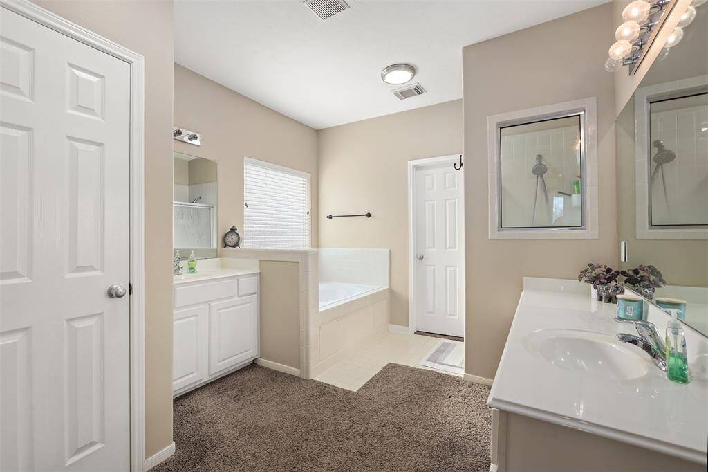 Primary Bath Features Dual Sink/Vanities, Jetted Tub & Separate Shower for Easy with Morning Routines