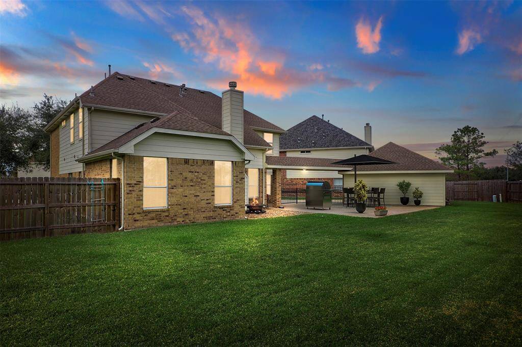 A Twilight View of the Virtually Staged Patio.  This Backyard Comes Complete with a Firepit to Cozy up to On those Cool Night!