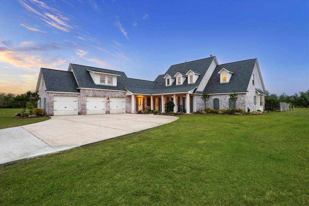 THIS NEW ORLEANS STYLE HOME FEATURES A 3- CAR GARAGE WITH CUSTOM WOOD DOORS AND HARDWARE, A BONUS ROOM ABOVE UTILIZED AS A MAN CAVE/LIBRARY OR GAME ROOM