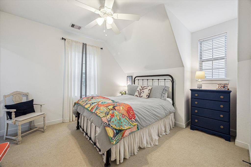 GUEST BEDROOM SITS ON THE RIGHT SIDE OF THE HOME UPSTAIRS AND CONNECTS TO THE EN-SUITE JACK & JILL BATHROOM
