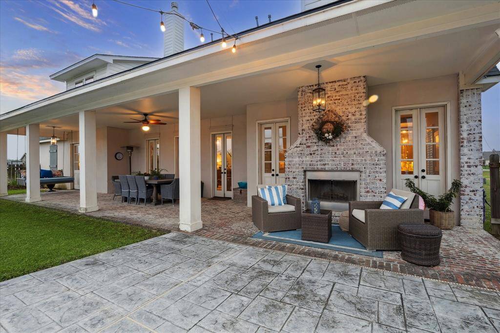 COZY UP ON STARRY NIGHTS AROUND THE BRICK GAS FIREPLACE WITH YOUR FAVORITE BEVERAGE, DIN WITH FAMILY AND FRIENDS ON THE LARGE COVERED PORCH WITH CEILING FAN. RELAX ON THE PORCH SWING ENJOYING THE MORNING BREEZE. BRICK FLOORING AND ALL DOORS OPEN TO THE BACK PORCH FOR  BREATH OF FRESH AIR ON COOL, FALL DAYS