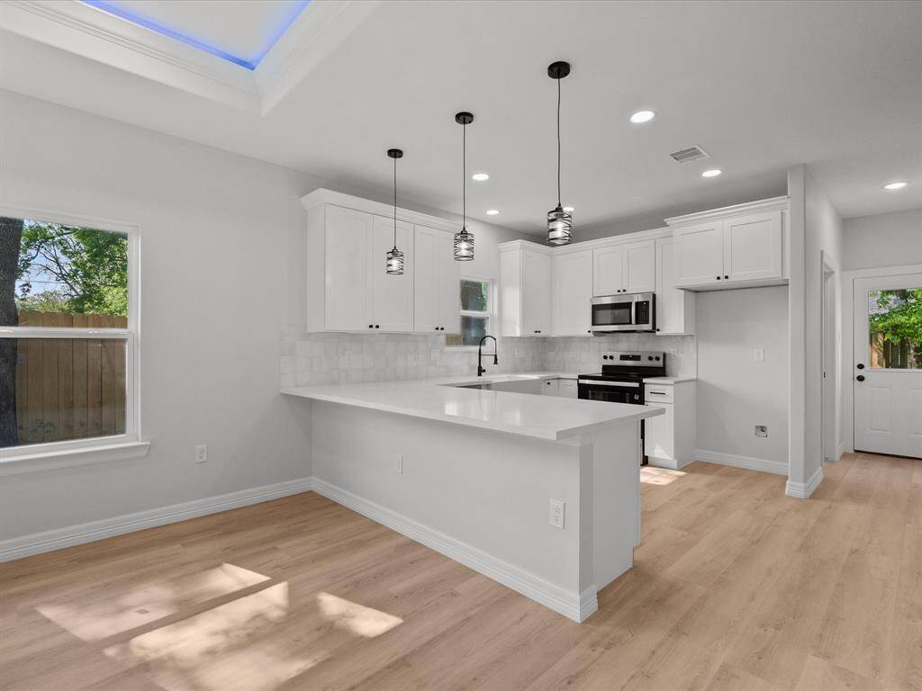 Lots Of Counter Space and Pendant Lighting