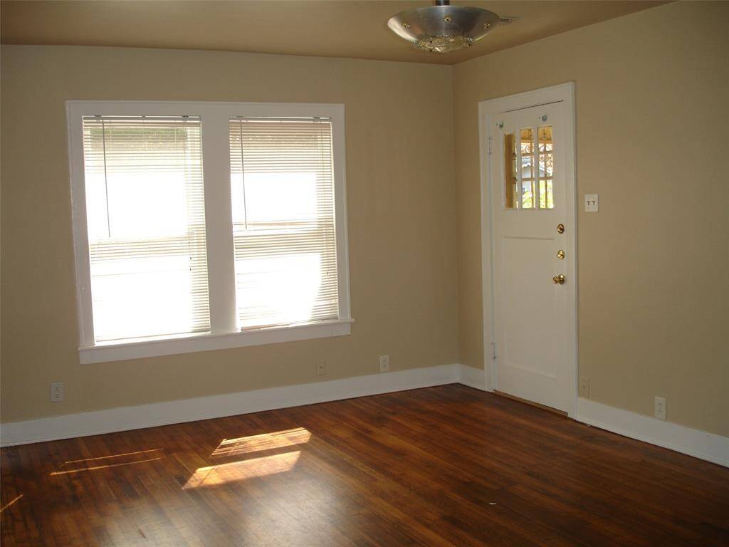 Come in and see the large livingwroom with hardwwood floors and lots of light.