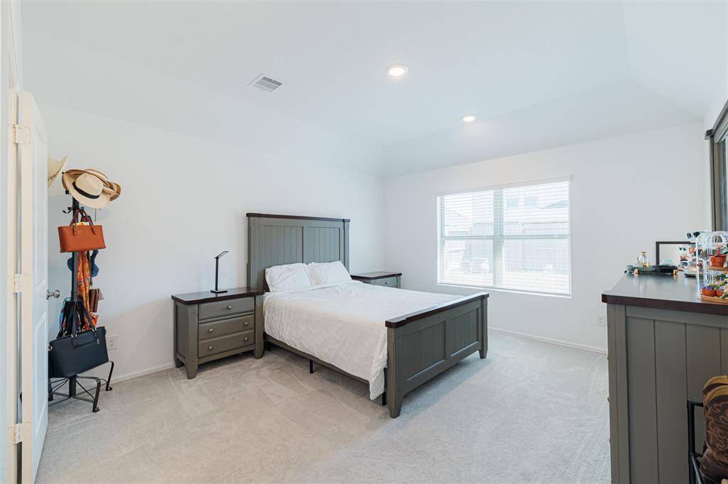 The serene primary suite offers an ensuite bath.