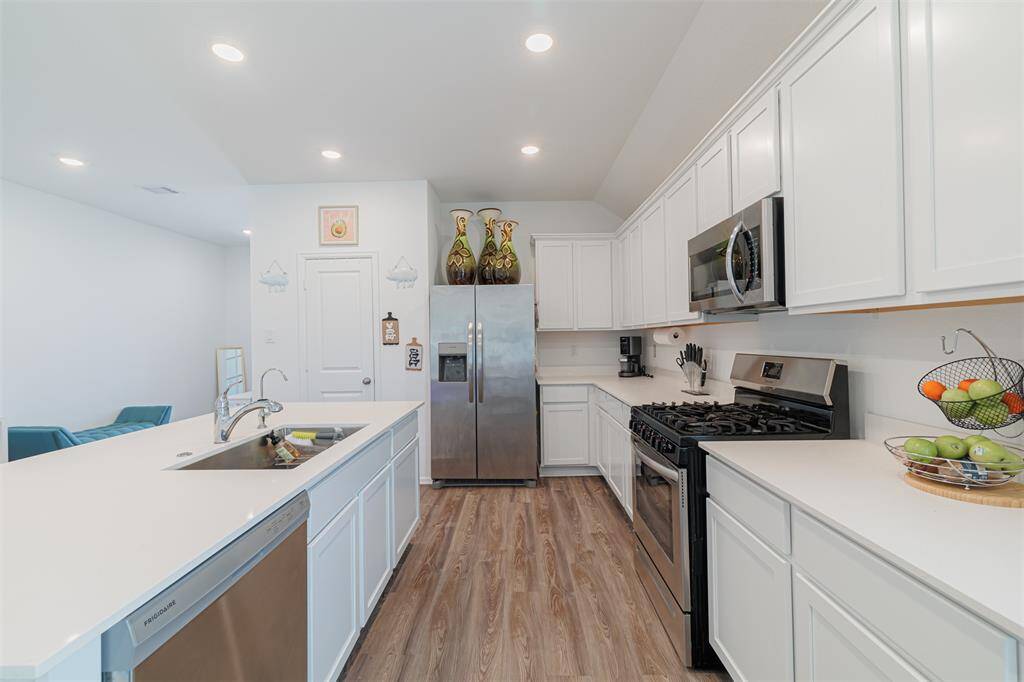 Kitchen features gas cooking and pantry.