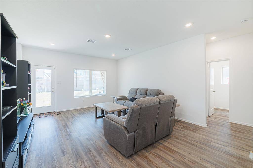Door off the family room leads to the backyard and covered patio.