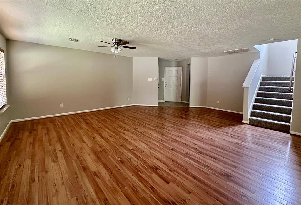 Formal Living Room with tucked away stairs