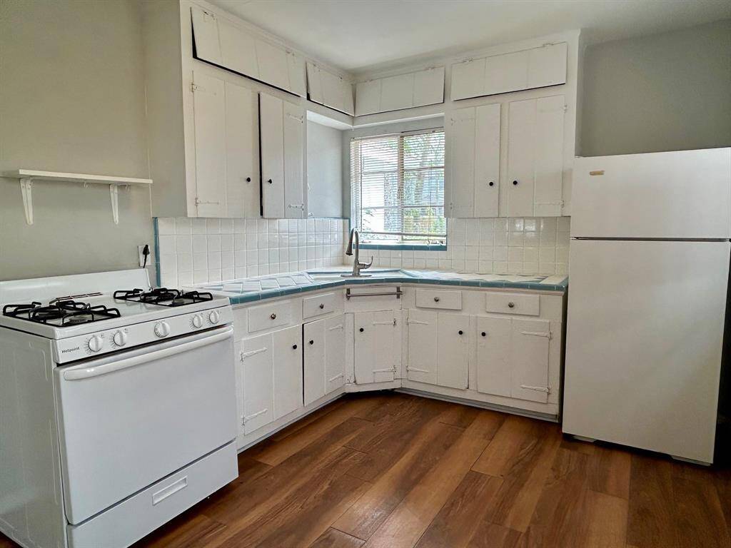 Kitchen with gas range/refrigerator included.