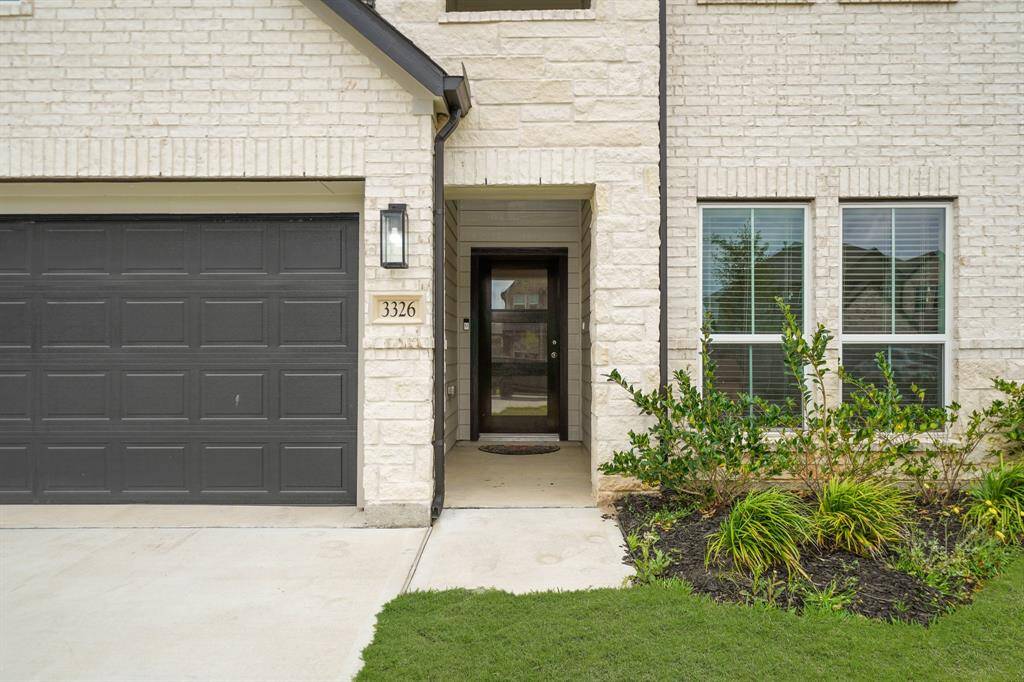 The stone and brick exterior exudes charm and elegance, creating exceptional street appeal that captivates at first glance.