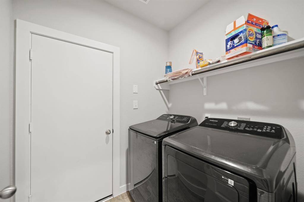 The thoughtfully designed mudroom features smart storage solutions, with custom lockers that effortlessly keep clutter under control.
