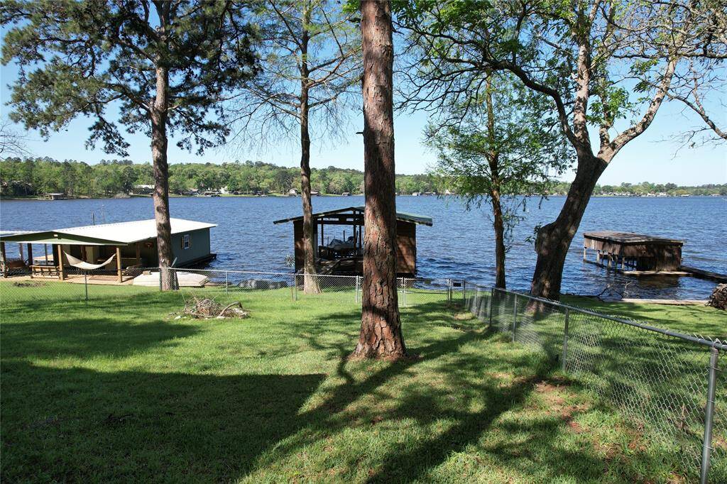 View of back yard facing the lake. Horshoes, cornhole, you name it can be played here.