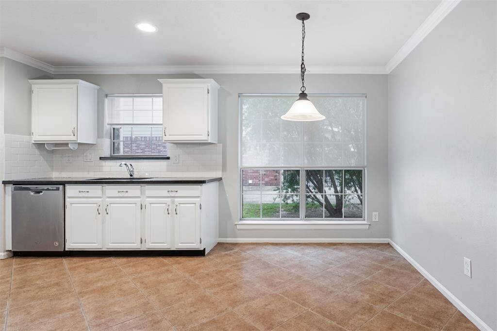 Dining room open to kitchen on left and to foyer on right.