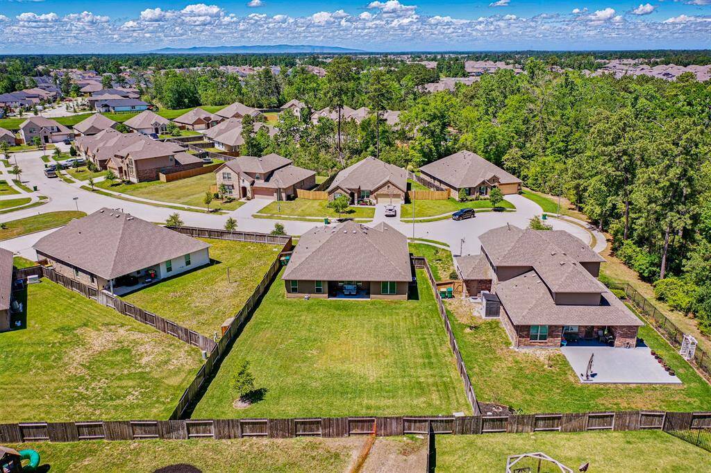 Expansive aerial view showcasing a spacious backyard, perfect for outdoor living.