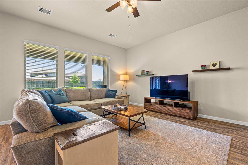 Spacious, inviting living room with abundant natural light.