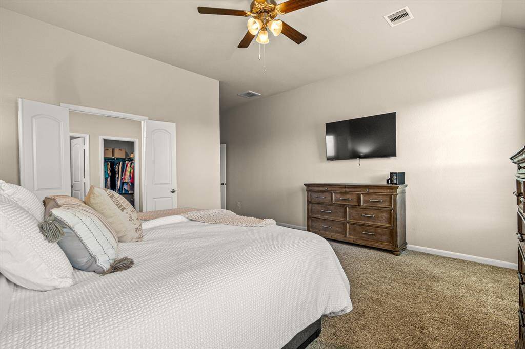 Luxurious primary suite featuring a spacious layout.  Perfect for comfort and relaxation.