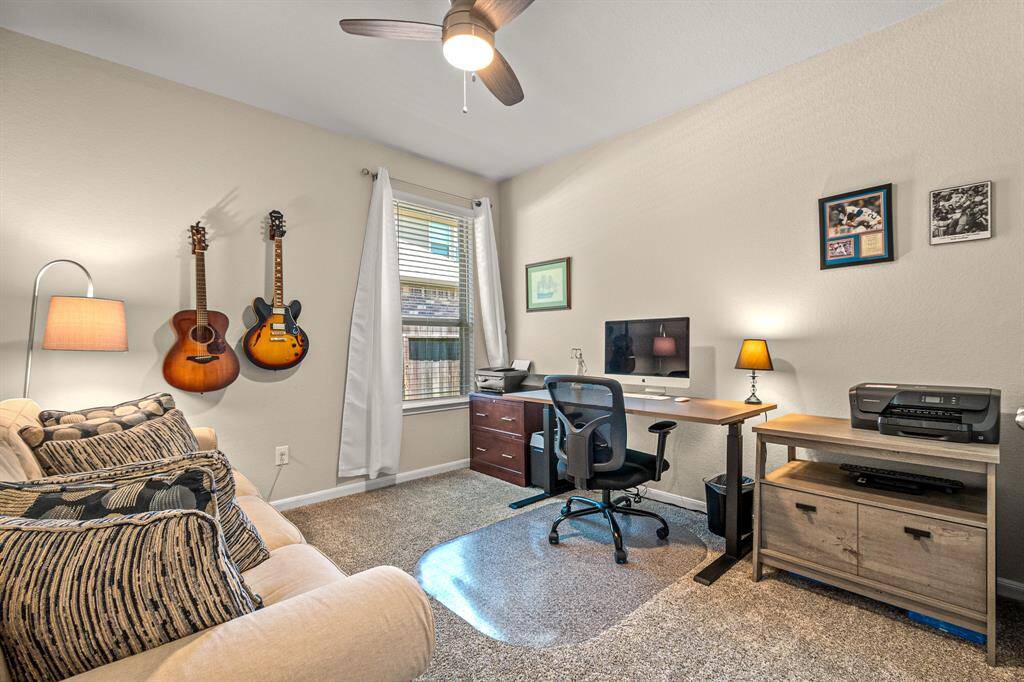 Versatile third bedroom ideal for guests or a perfect home office.